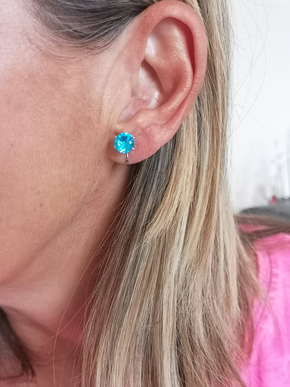 rhodium plated aqua clip on earrings in ear