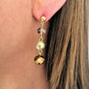 triple gold clear and bronze ball dangly earrings
