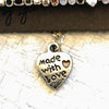 Close up of Made with love heart on bracelet