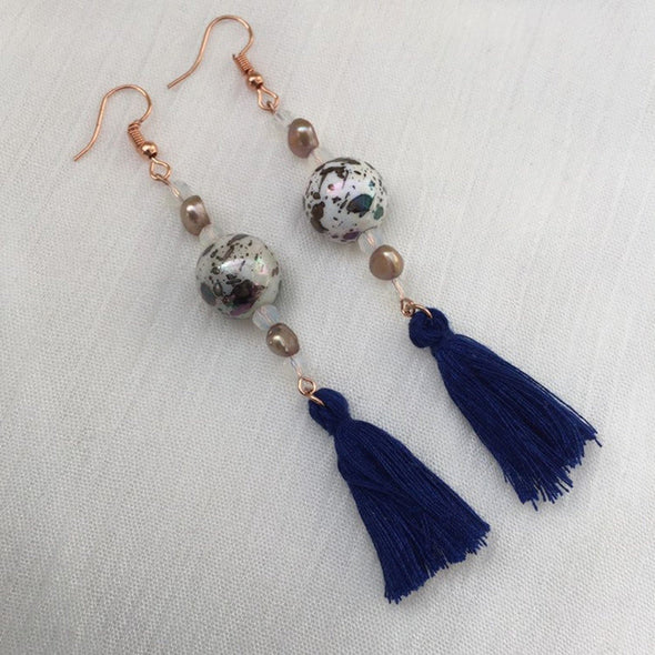 Navy vintage style earrings with beads and tassels side view
